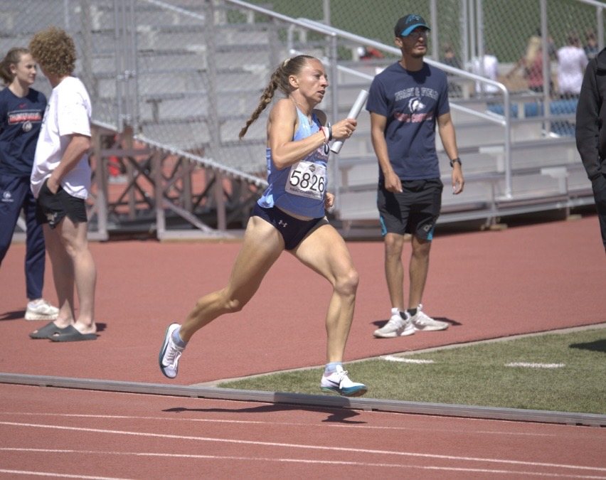 Helen Braybrook running a relay exchange