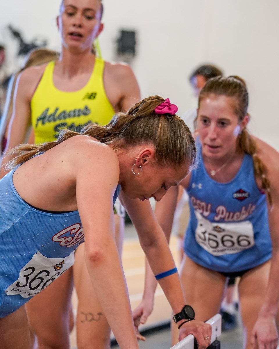Runners focused on the start line before a race