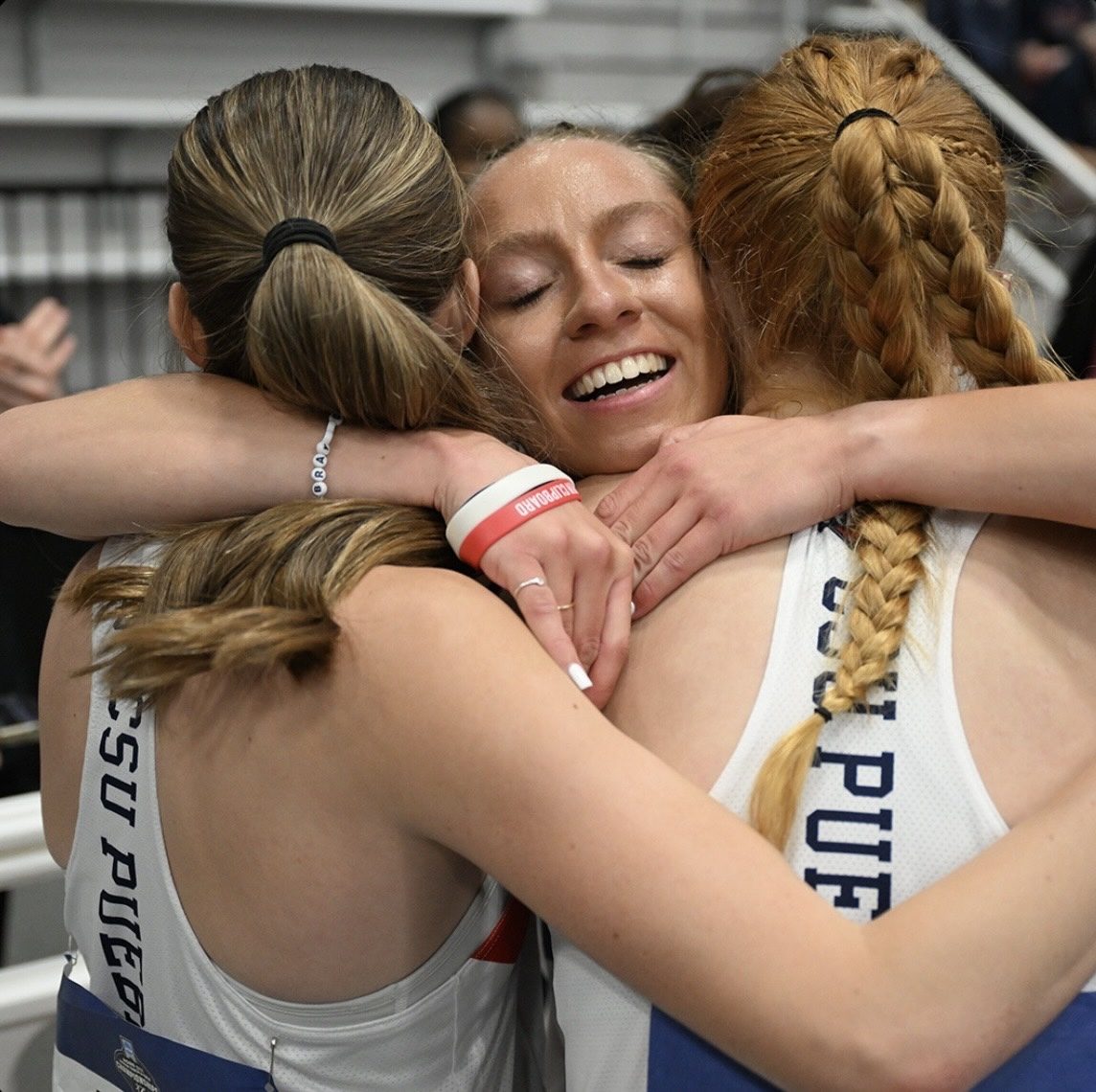 Helen Braybrook embracing teammates after a race
